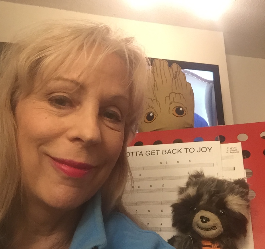 Selfie photo alongside a scoresheet for Gotta Get Back to Joy.

Rocket Racoon and Groot stuffed animals are also seen.